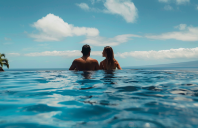 A couple in an infinity pool of a villa rental in Big Island, Hawaii.
